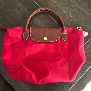 NWOT red le pliage longchamp mini tote.